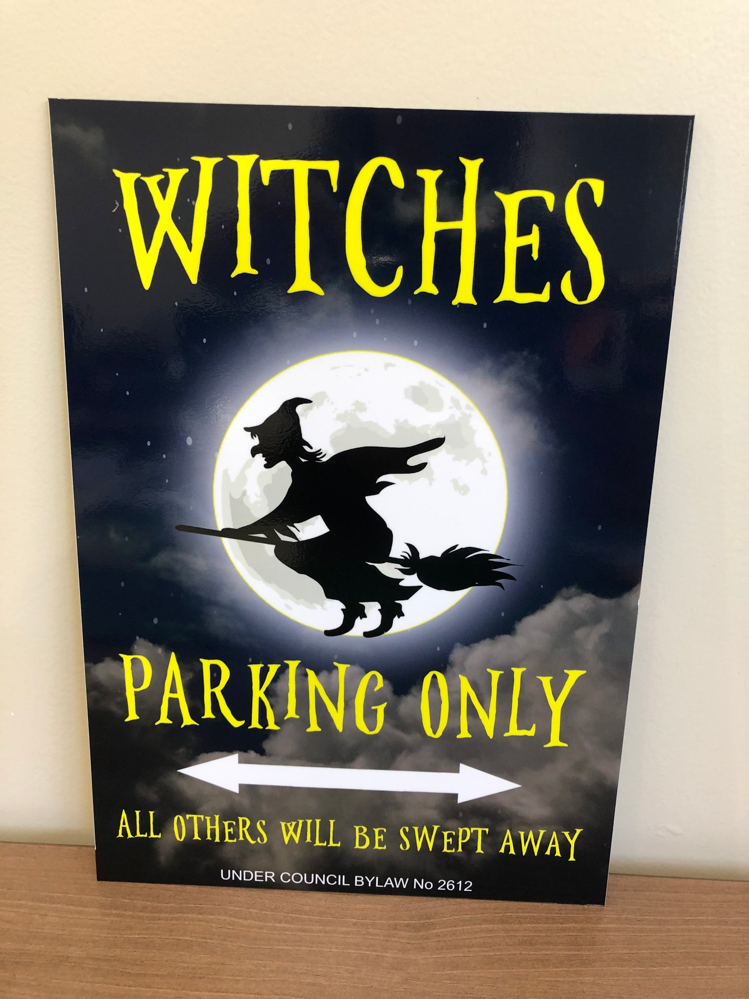 Witches parking only sign